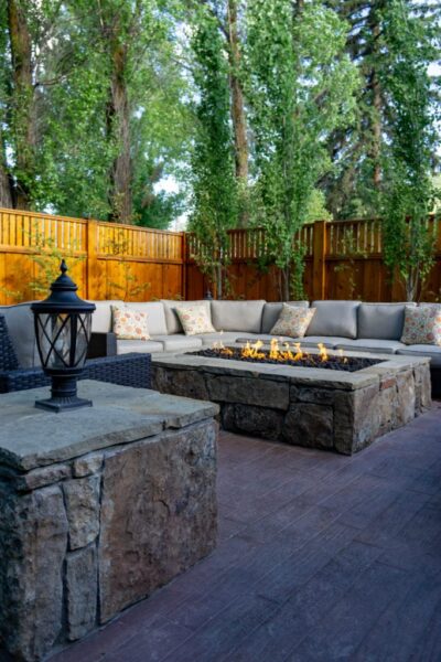 Image of fire pit and lounge area at Huff House Inn and Cabins